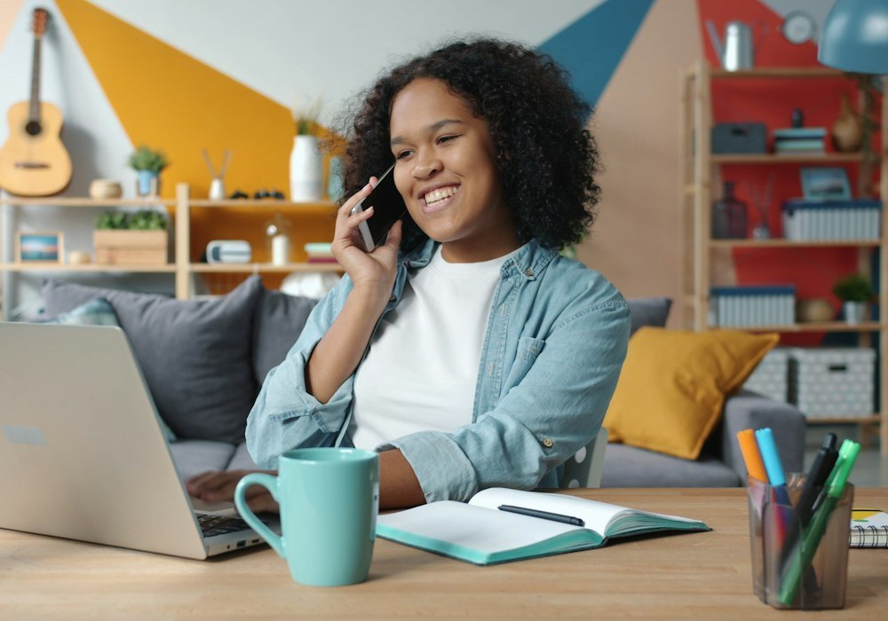 Smiling woman on a phone call
